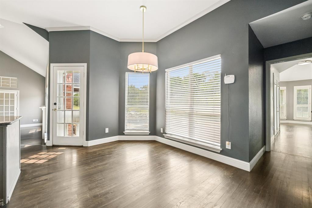 1380 Meandro Ria Lane Fairview, TX 75069 - Photo 14 of 39 Wood-finish flooring, recessed lighting, and a drum pendant light fixture illuminate the interior