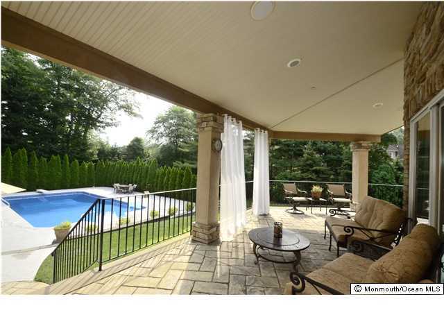 125 Ave Of Two Rivers, Unit OF Rumson, NJ 07760 - Photo 3 of 3 a outdoor living space with patio furniture and garden view