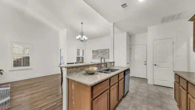 a kitchen that has a lot of cabinets in it