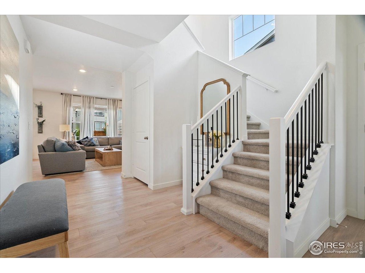 5572 Mare Lane Timnath, CO 80547 - Photo 4 of 36 a living room with furniture and a dining table