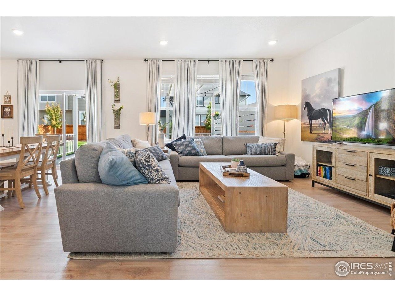 5572 Mare Lane Timnath, CO 80547 - Photo 7 of 36 a living room with furniture and a large window