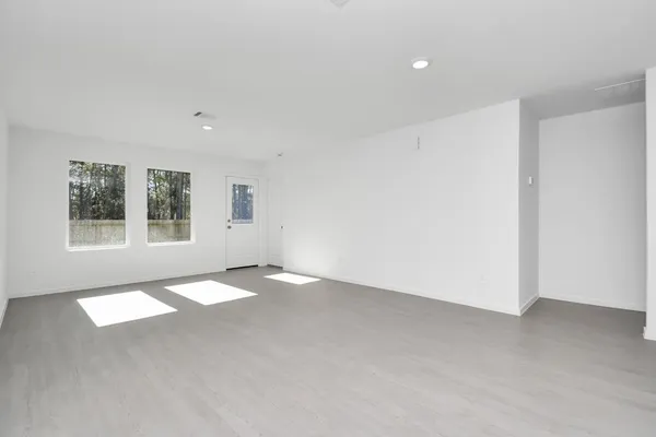 an empty room with windows