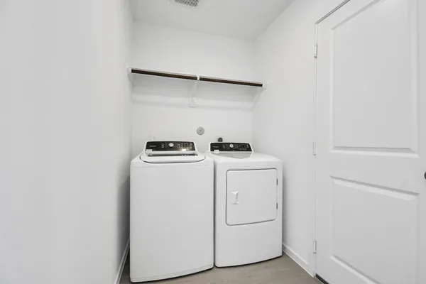 a utility room with dryer and washer