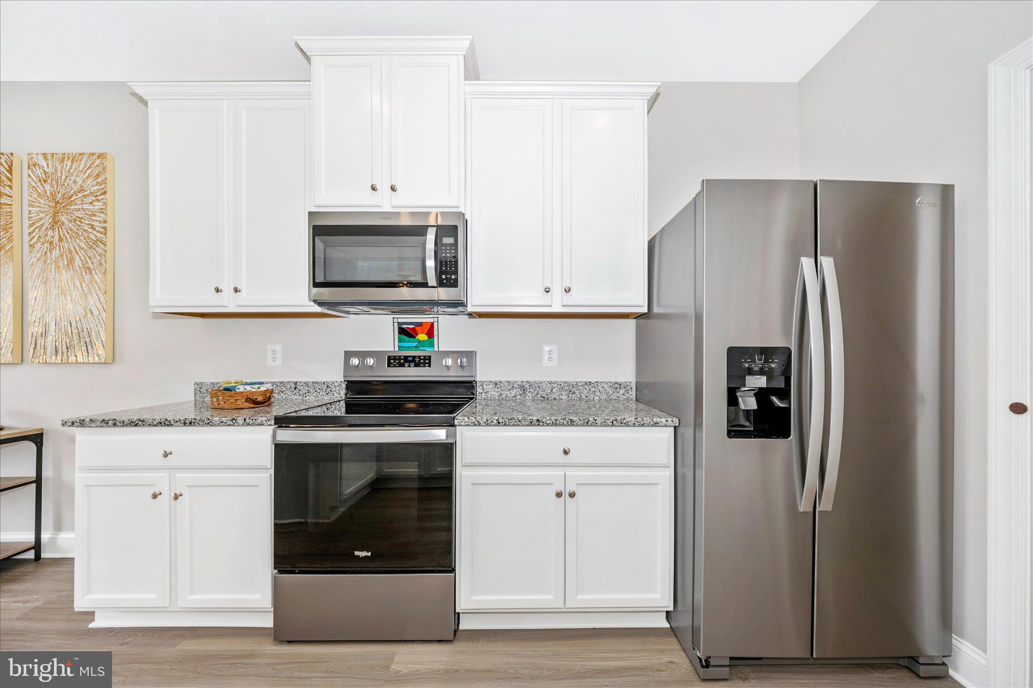 10026 Roulette Drive Hagerstown, MD 21740 - Photo 24 of 73 a kitchen with stainless steel appliances granite countertop a refrigerator stove and sink