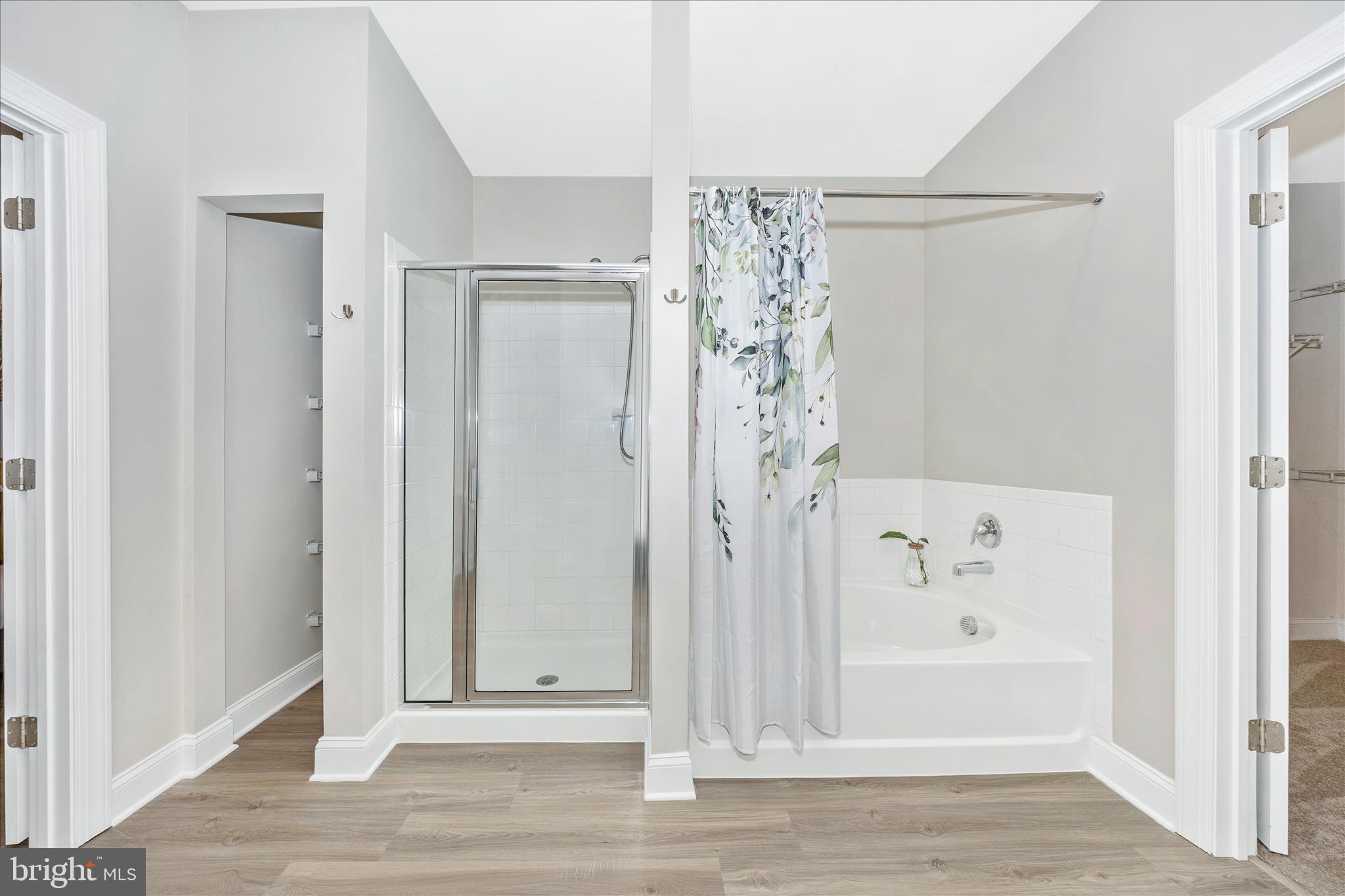 10026 Roulette Drive Hagerstown, MD 21740 - Photo 30 of 73 a view of a bathroom with a shower and a bath tub