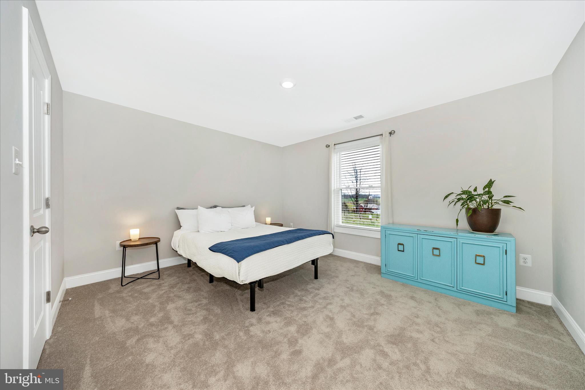 10026 Roulette Drive Hagerstown, MD 21740 - Photo 36 of 73 a spacious bedroom with a bed and a window