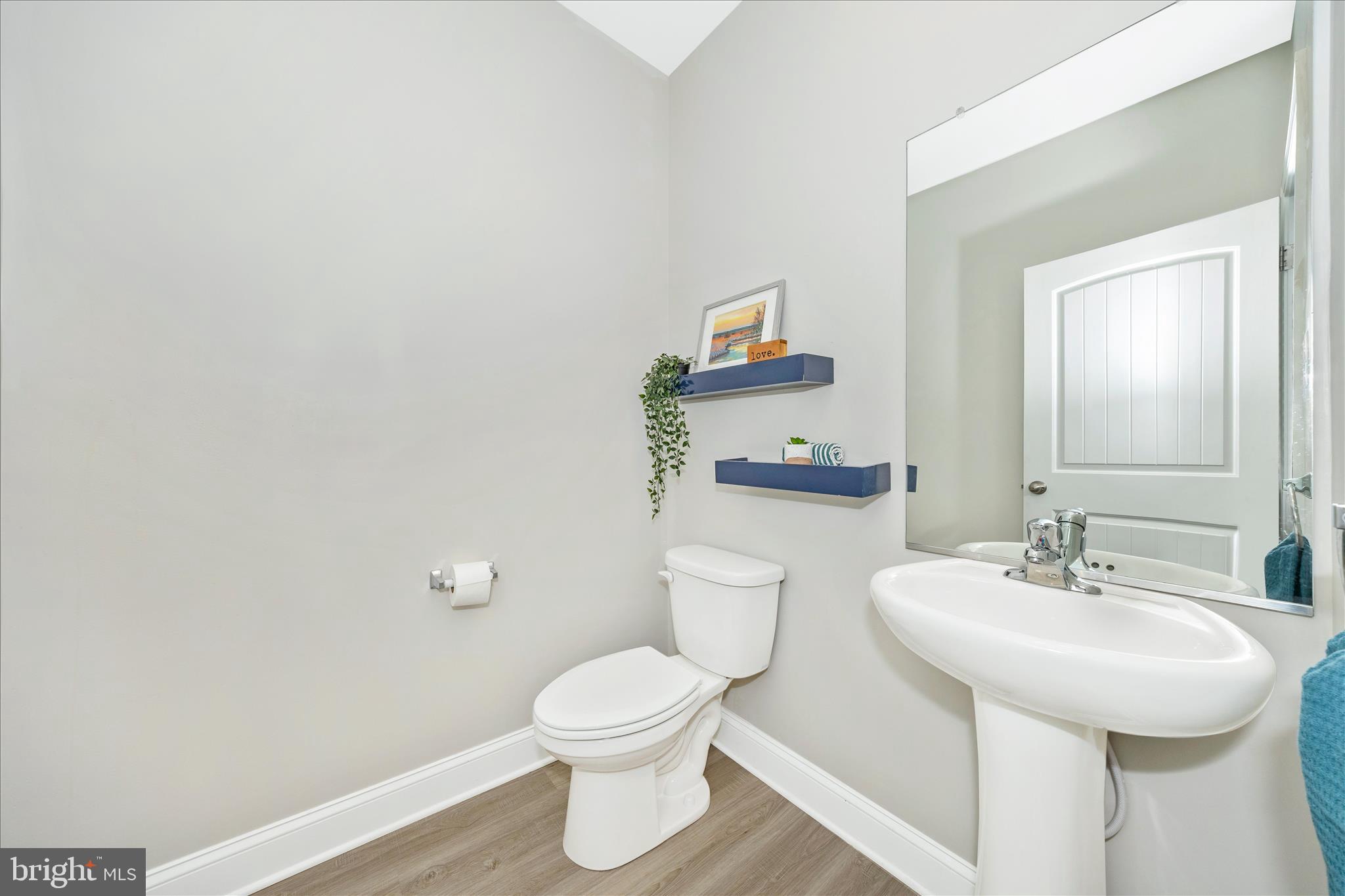 10026 Roulette Drive Hagerstown, MD 21740 - Photo 46 of 73 a bathroom with a toilet sink and mirror