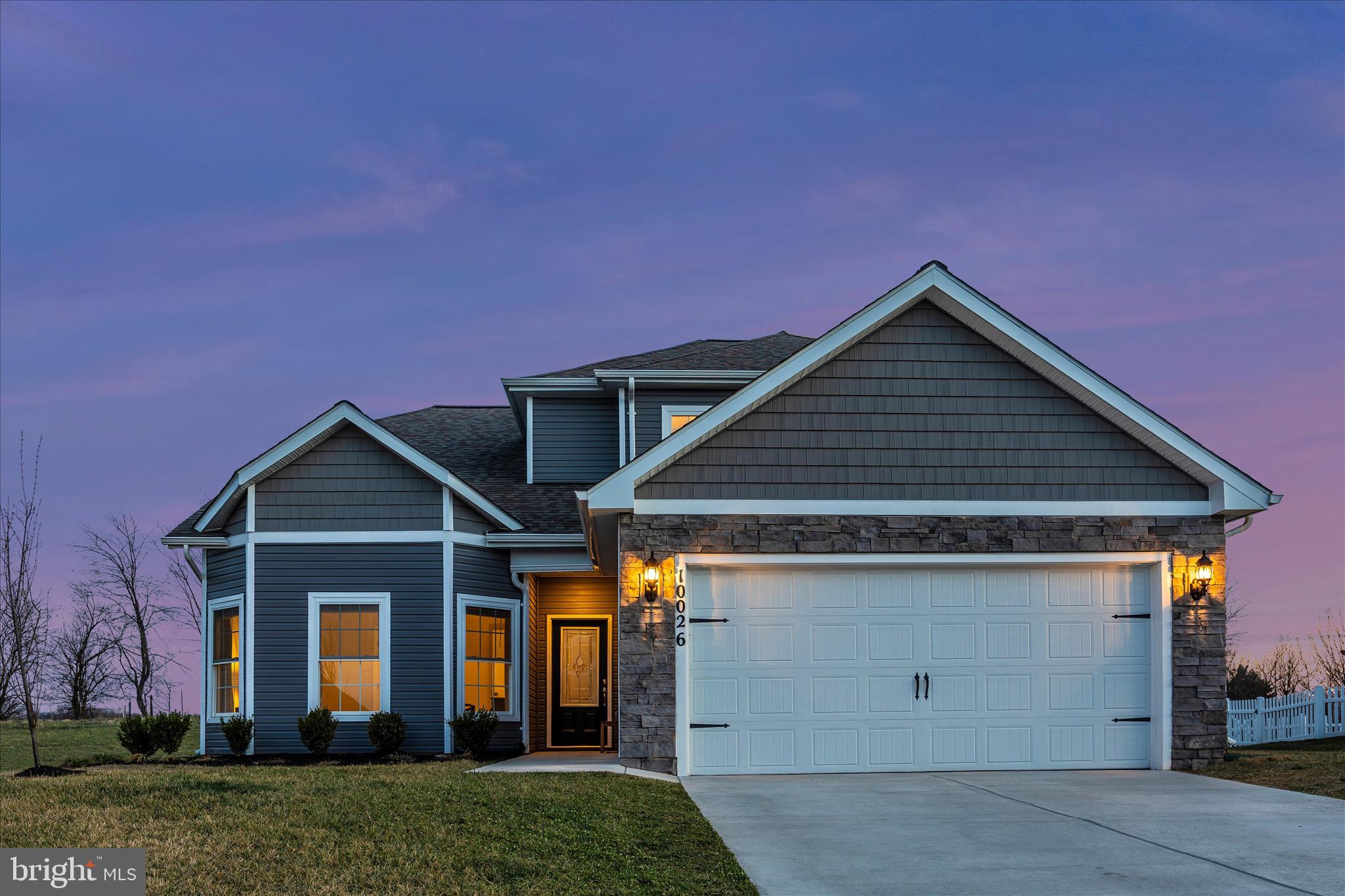 10026 Roulette Drive Hagerstown, MD 21740 - Photo 5 of 73 a front view of a house with a yard and garage