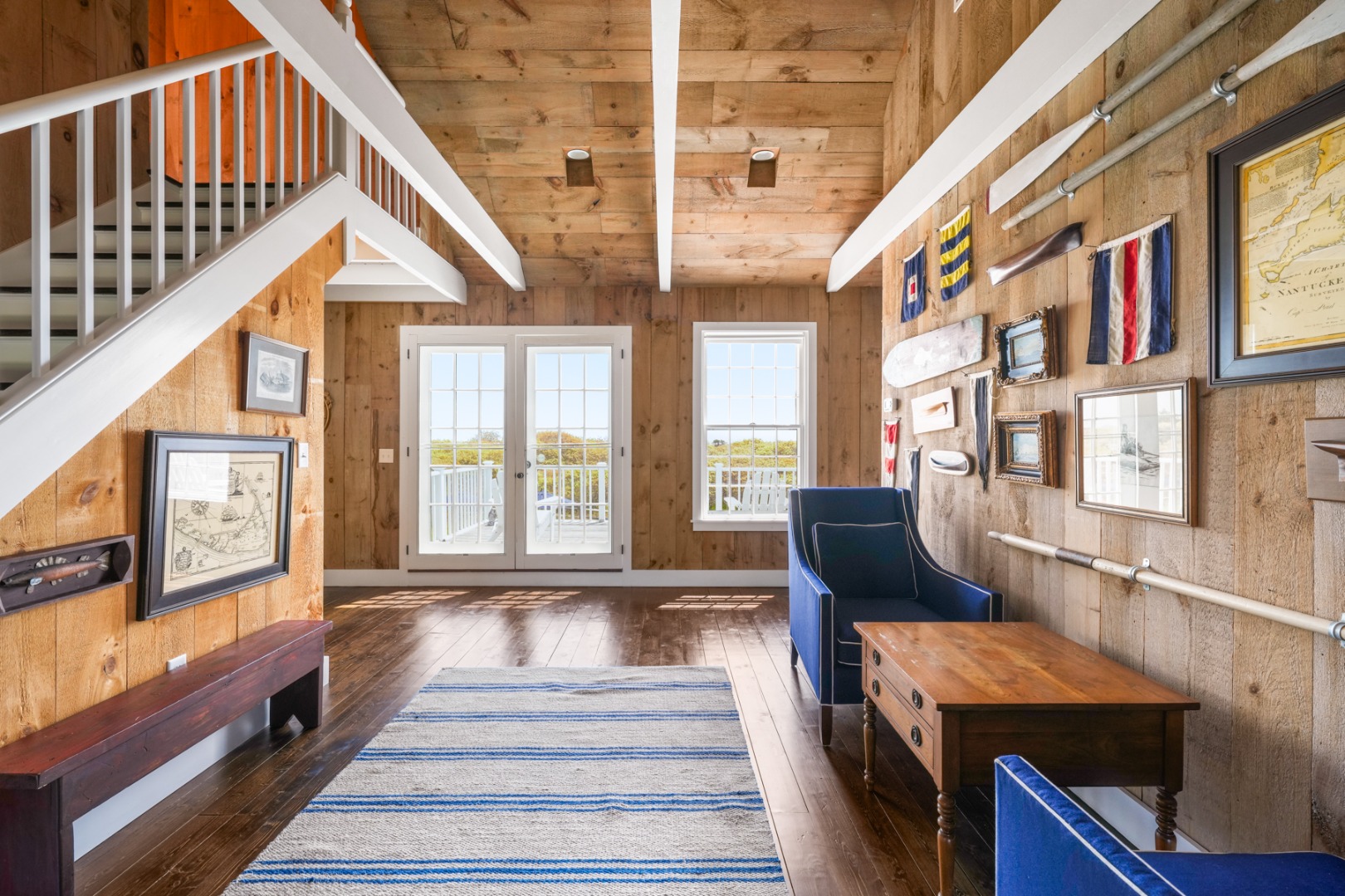 21 Quidnet Road Nantucket, MA 02554 - Photo 25 of 62 a view of a livingroom with furniture staircase windows and kitchen view