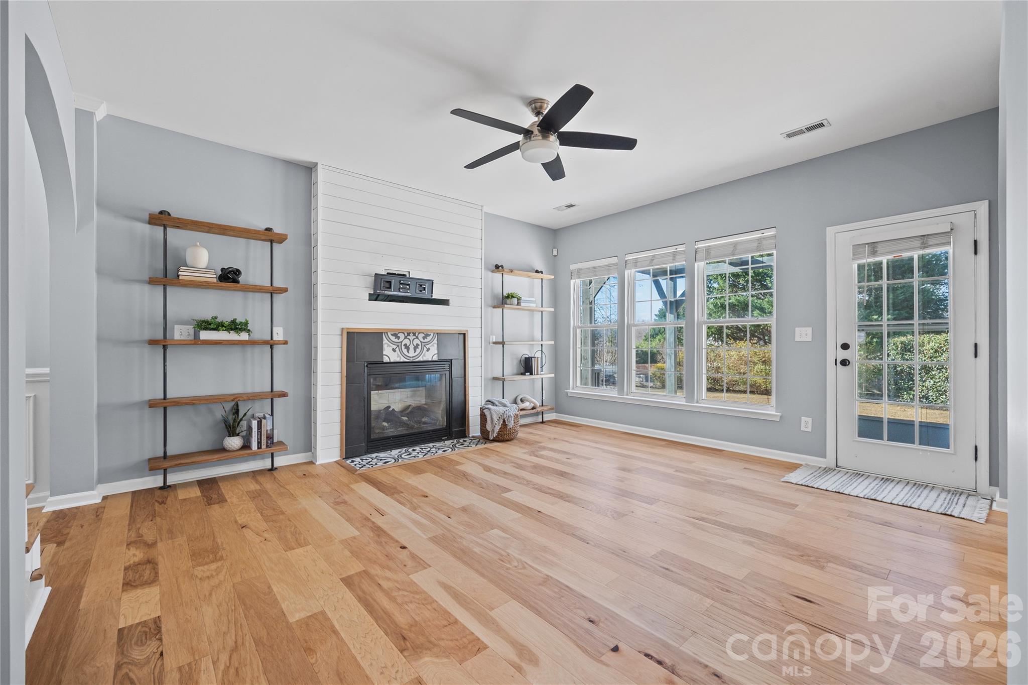 3110 Tanzanite Circle Fort Mill, SC 29708 - Photo 15 of 48 a view of empty room with a fireplace and fan