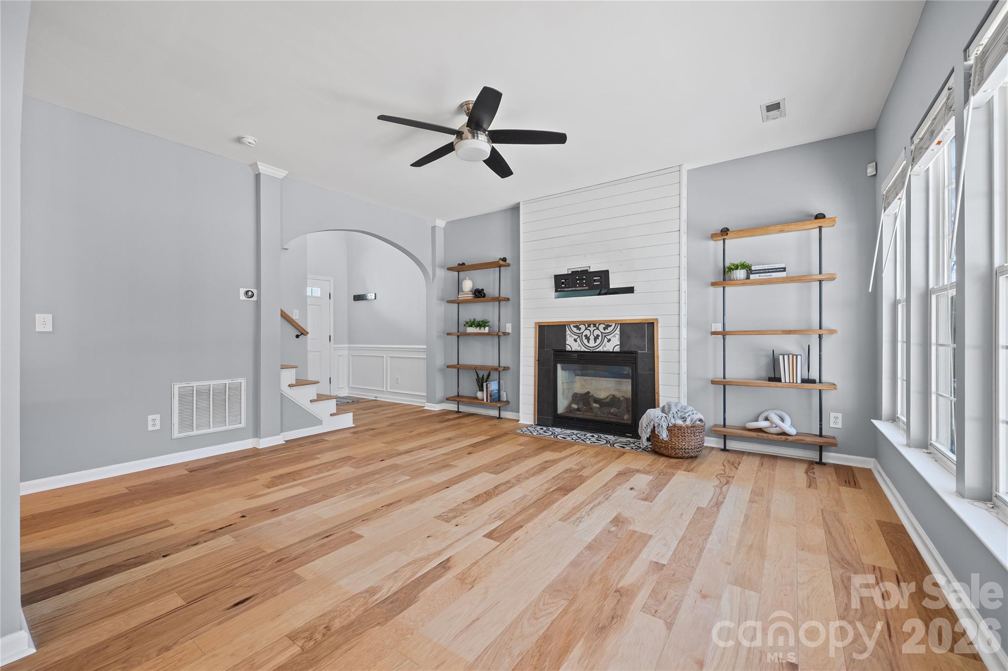 3110 Tanzanite Circle Fort Mill, SC 29708 - Photo 17 of 48 a spacious bedroom with a bed and a fireplace