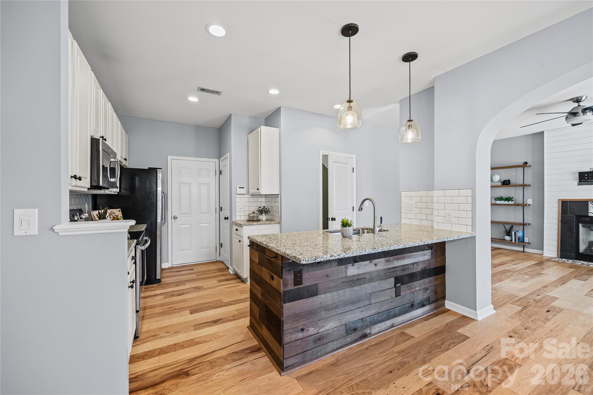 3110 Tanzanite Circle Fort Mill, SC 29708 - Photo 19 of 48 a view of a kitchen counter space and wooden floor