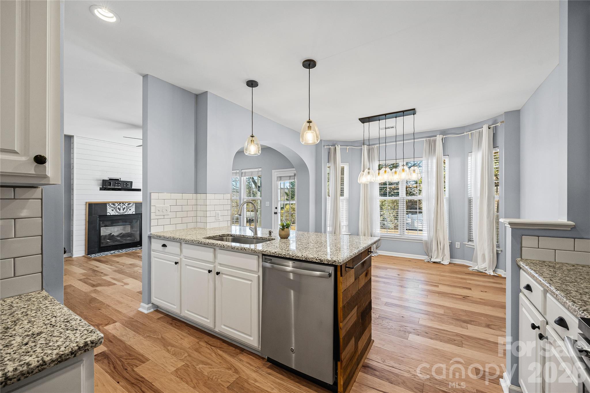 3110 Tanzanite Circle Fort Mill, SC 29708 - Photo 25 of 48 a kitchen with granite countertop a sink and cabinets
