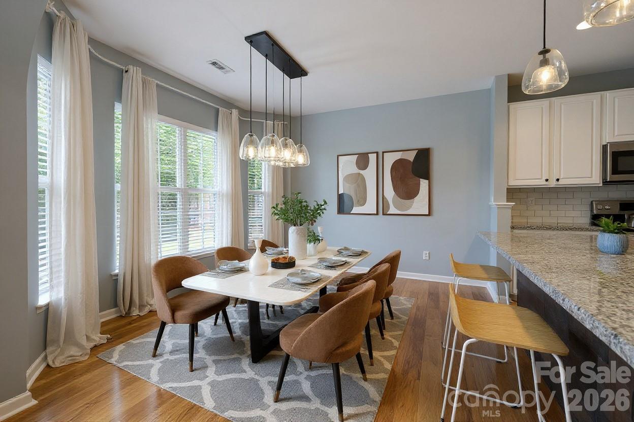 3110 Tanzanite Circle Fort Mill, SC 29708 - Photo 26 of 48 a view of a dining room with furniture window and wooden floor