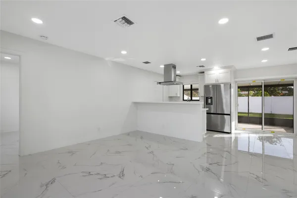 a view of an empty room with a window