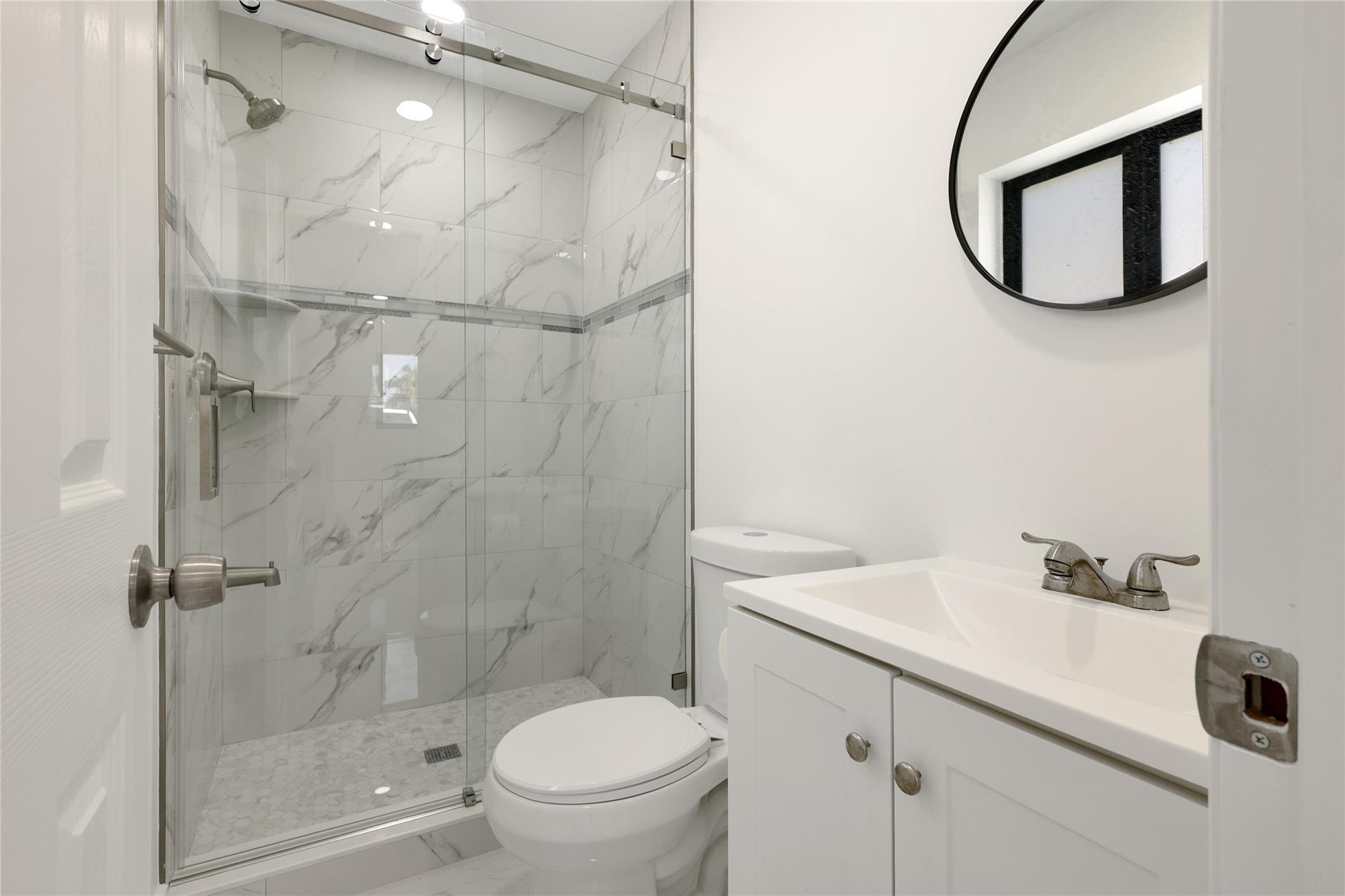 6374 Southwest 2nd Street Margate, FL 33068 - Photo 17 of 28 a bathroom with a sink toilet and shower