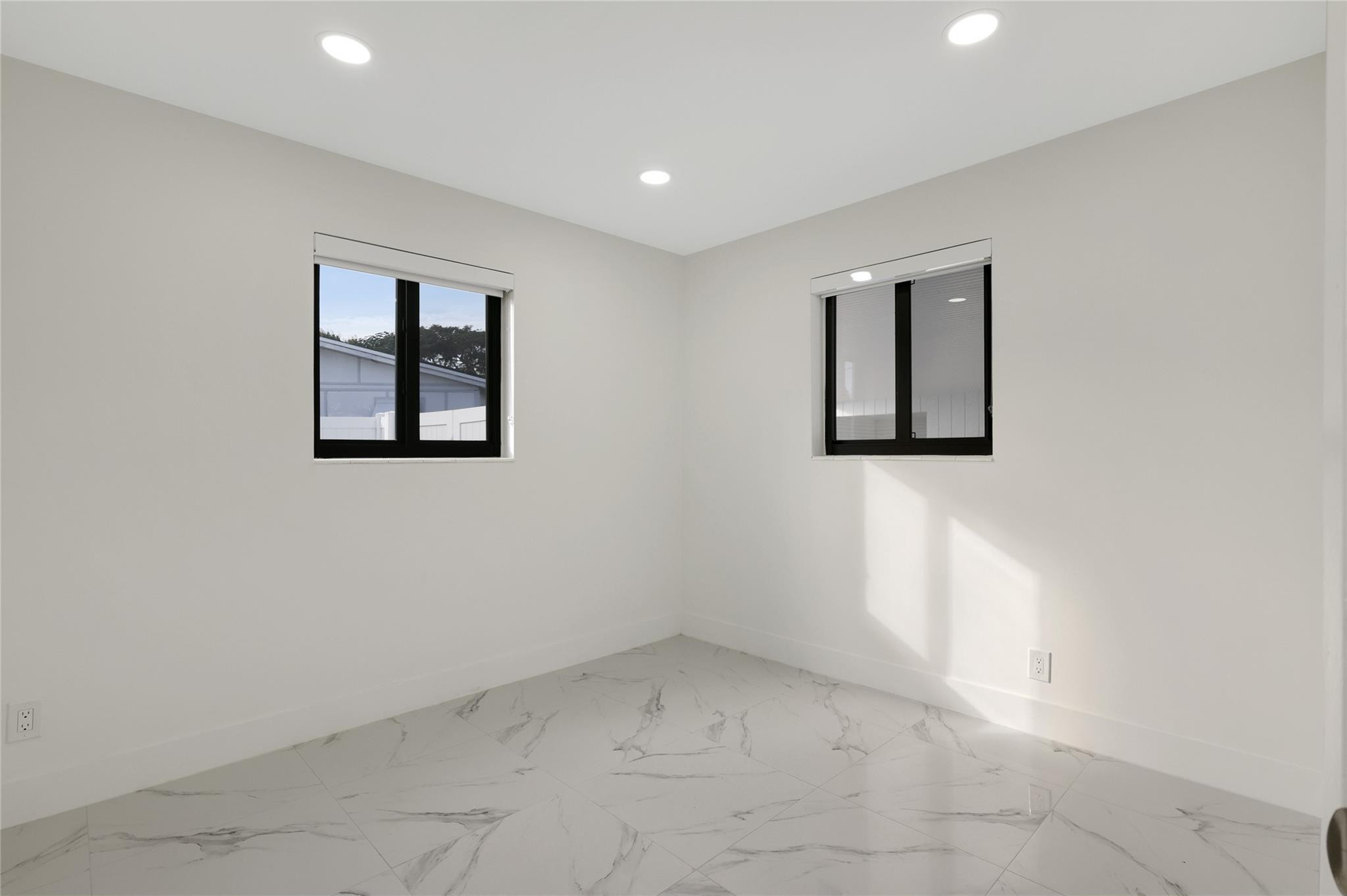 6374 Southwest 2nd Street Margate, FL 33068 - Photo 18 of 28 an empty room with windows