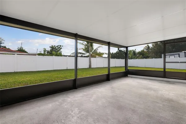 a view of an outdoor space with wooden floor
