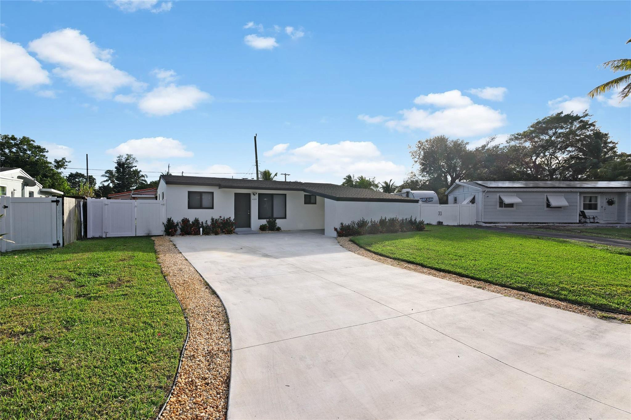 6374 Southwest 2nd Street Margate, FL 33068 - Photo 3 of 28 a view of a house with a yard
