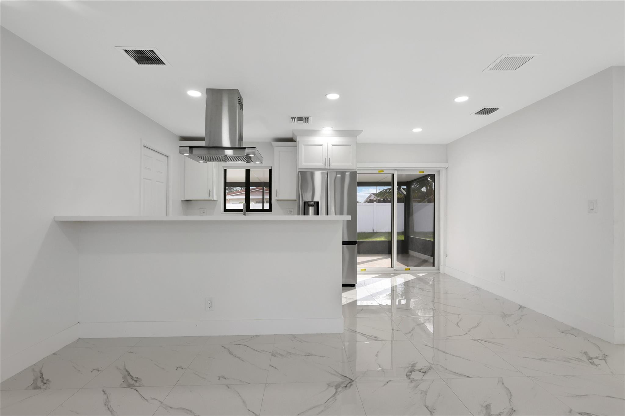 6374 Southwest 2nd Street Margate, FL 33068 - Photo 8 of 28 a view of a kitchen with refrigerator and window