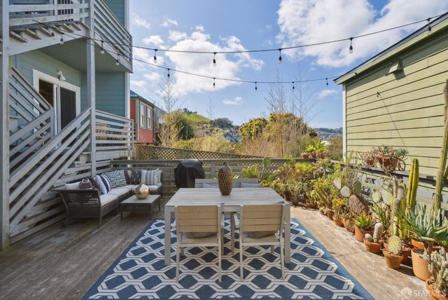 a view of a chairs and table in the patio