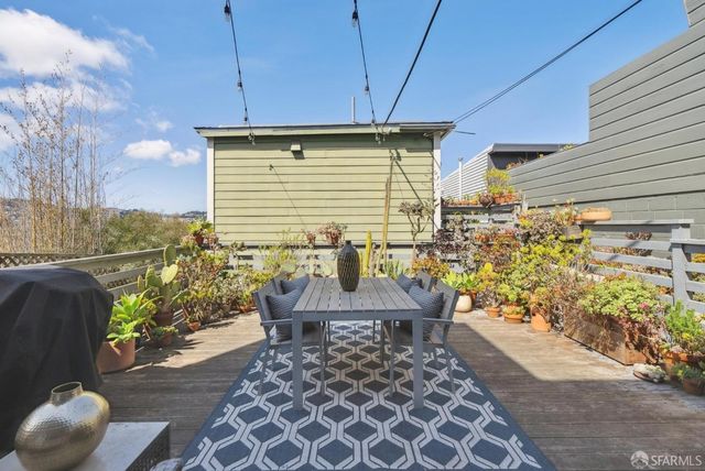 a view of a chairs and table in the patio