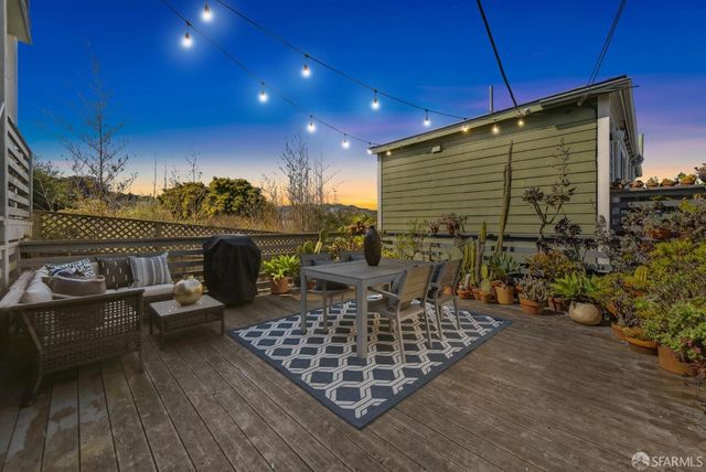 a wooden bench sitting in front of a building