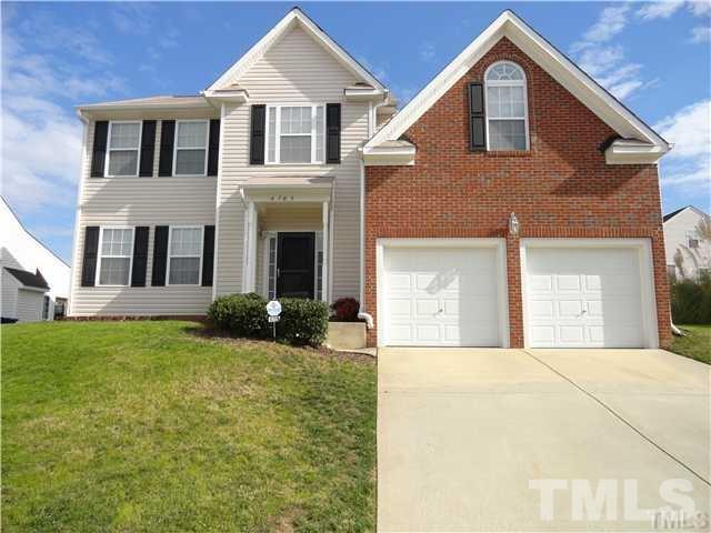 4705 Alenja Lane Raleigh, NC 27616 - Photo 1 of 15 a front view of a house with garden