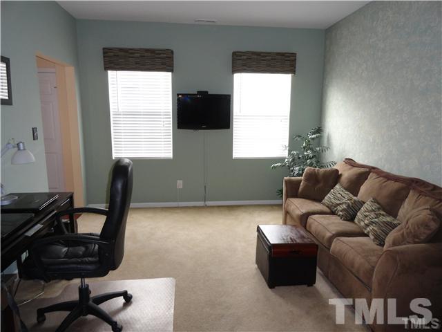 4705 Alenja Lane Raleigh, NC 27616 - Photo 2 of 15 a living room with furniture and a window