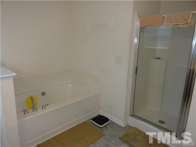 4705 Alenja Lane Raleigh, NC 27616 - Photo 12 of 15 a bathroom with a bathtub