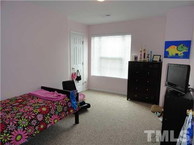 4705 Alenja Lane Raleigh, NC 27616 - Photo 14 of 15 a bedroom with a bed and window