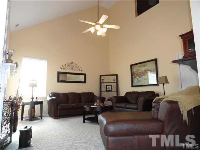 4705 Alenja Lane Raleigh, NC 27616 - Photo 7 of 15 a living room with furniture and a chandelier