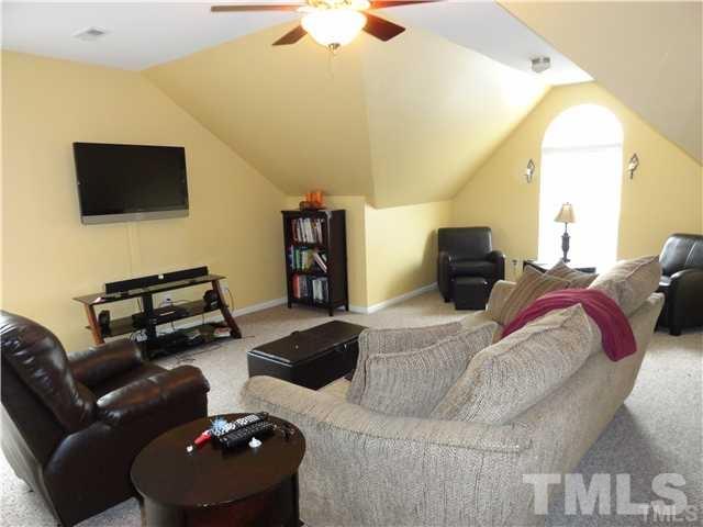 4705 Alenja Lane Raleigh, NC 27616 - Photo 10 of 15 a living room with furniture and a flat screen tv