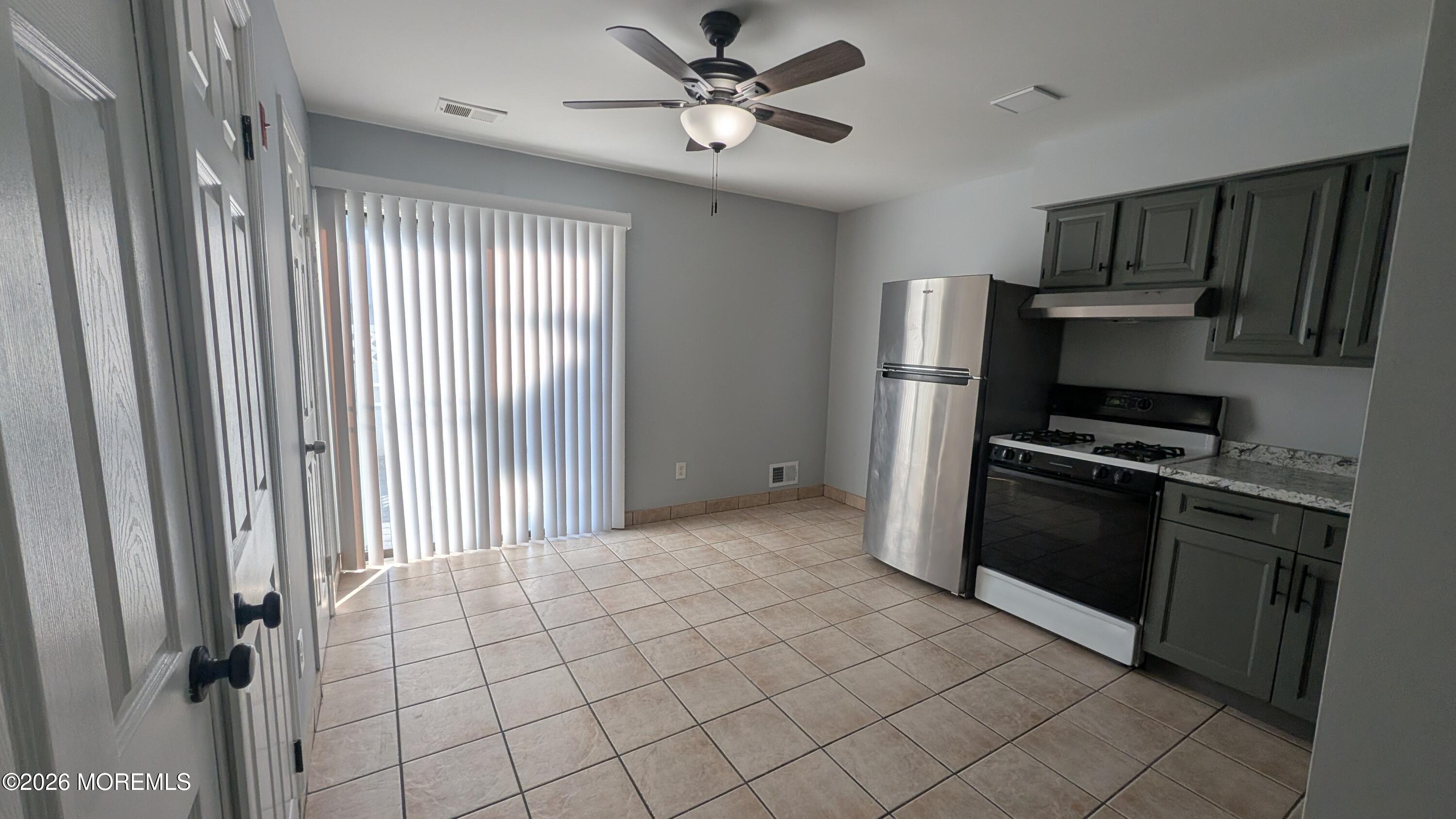 36 Creek Road, Unit 276 Brick, NJ 08724 - Photo 12 of 27 a kitchen with stainless steel appliances a refrigerator and a stove top oven
