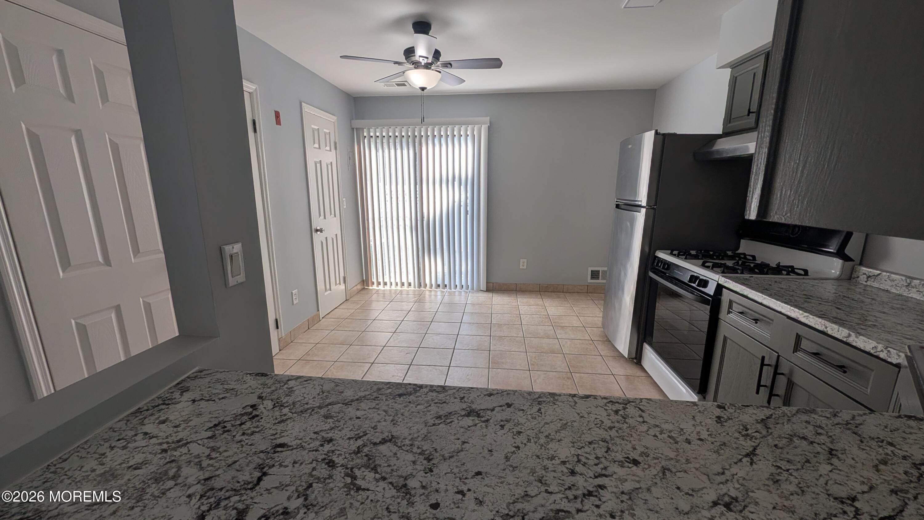 36 Creek Road, Unit 276 Brick, NJ 08724 - Photo 13 of 27 a view of a kitchen with fridge and wooden floor