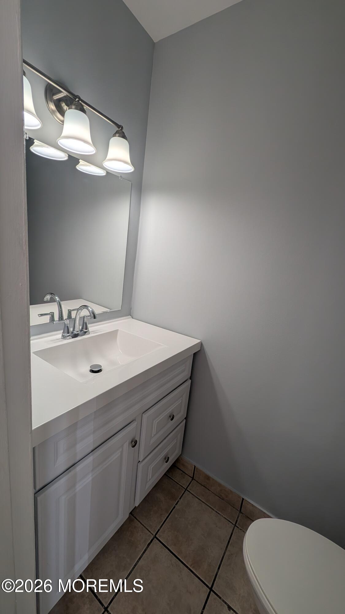 36 Creek Road, Unit 276 Brick, NJ 08724 - Photo 16 of 27 a bathroom with a sink mirror vanity and toilet