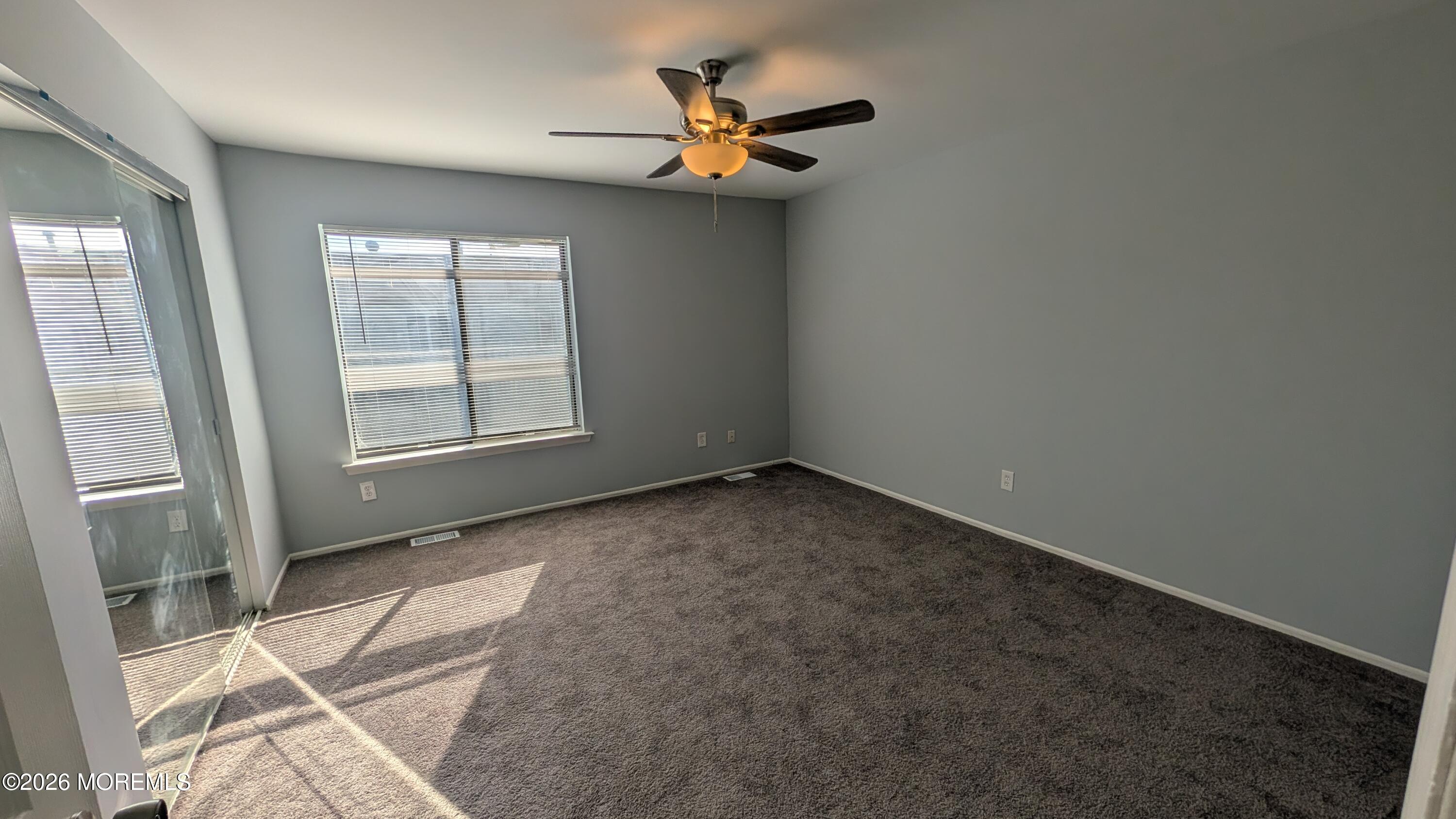 36 Creek Road, Unit 276 Brick, NJ 08724 - Photo 18 of 27 an empty room with windows and fan
