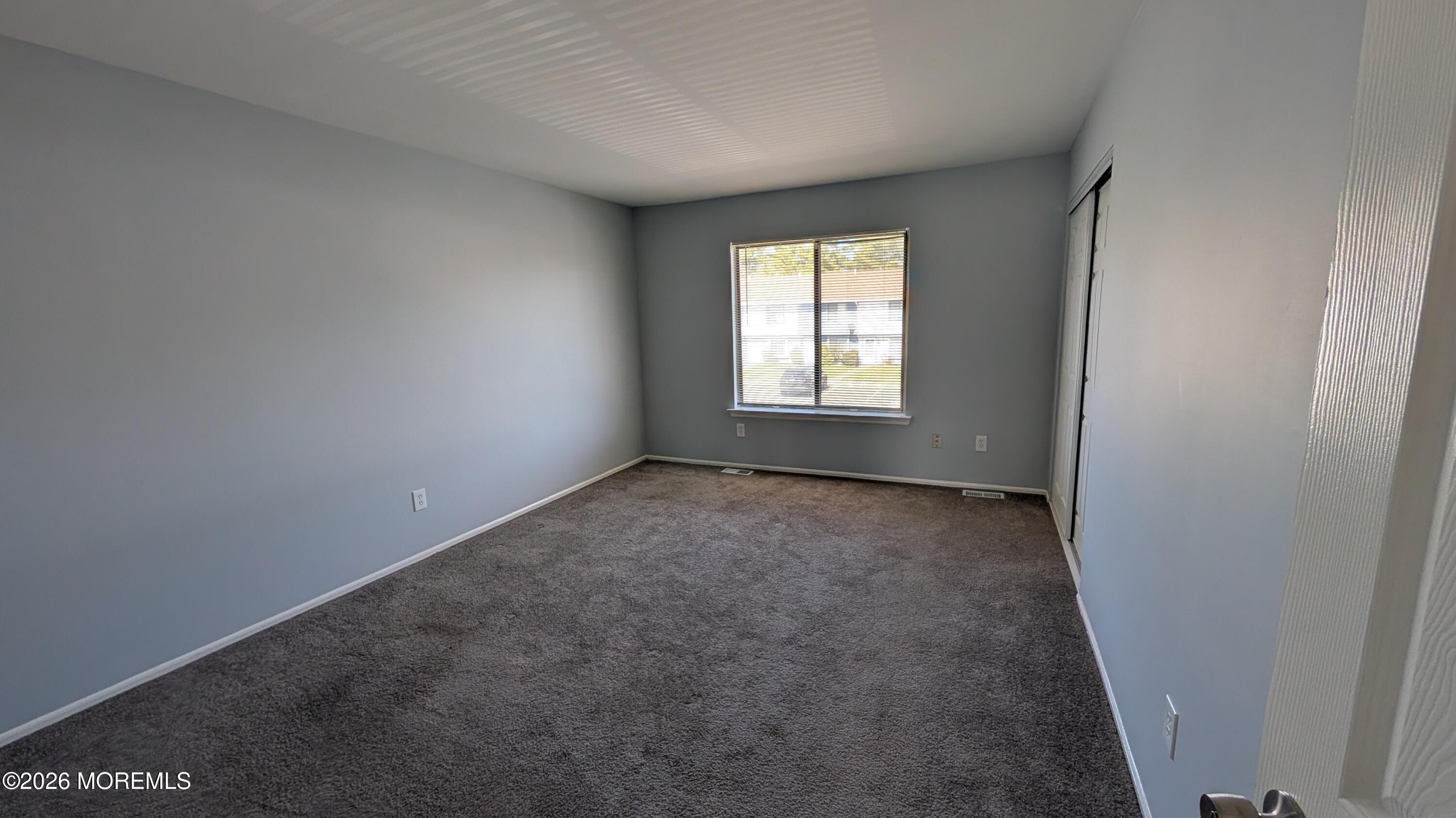 36 Creek Road, Unit 276 Brick, NJ 08724 - Photo 20 of 27 an empty room with a empty space and windows