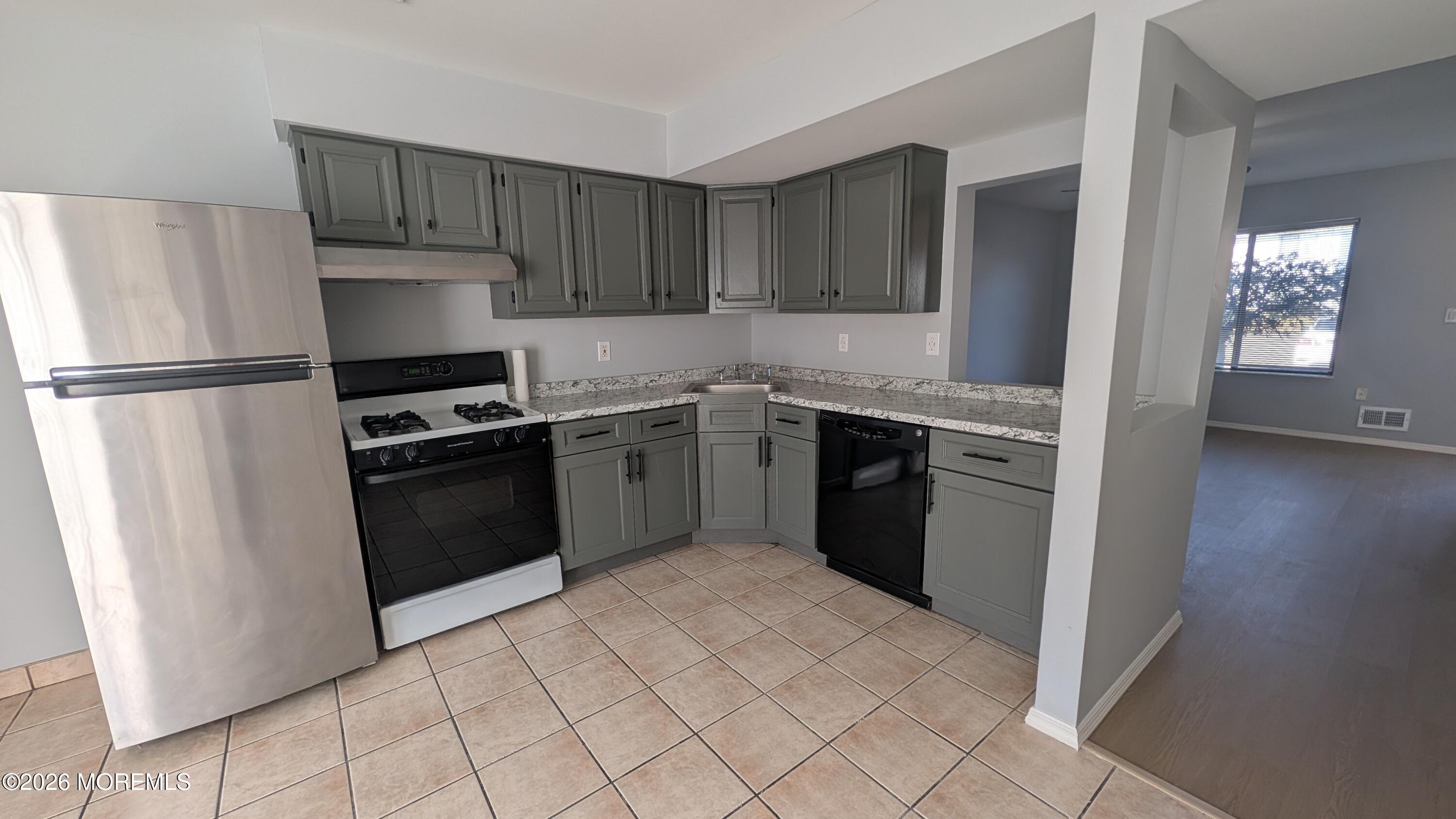 36 Creek Road, Unit 276 Brick, NJ 08724 - Photo 9 of 27 a kitchen with a sink appliances and cabinets