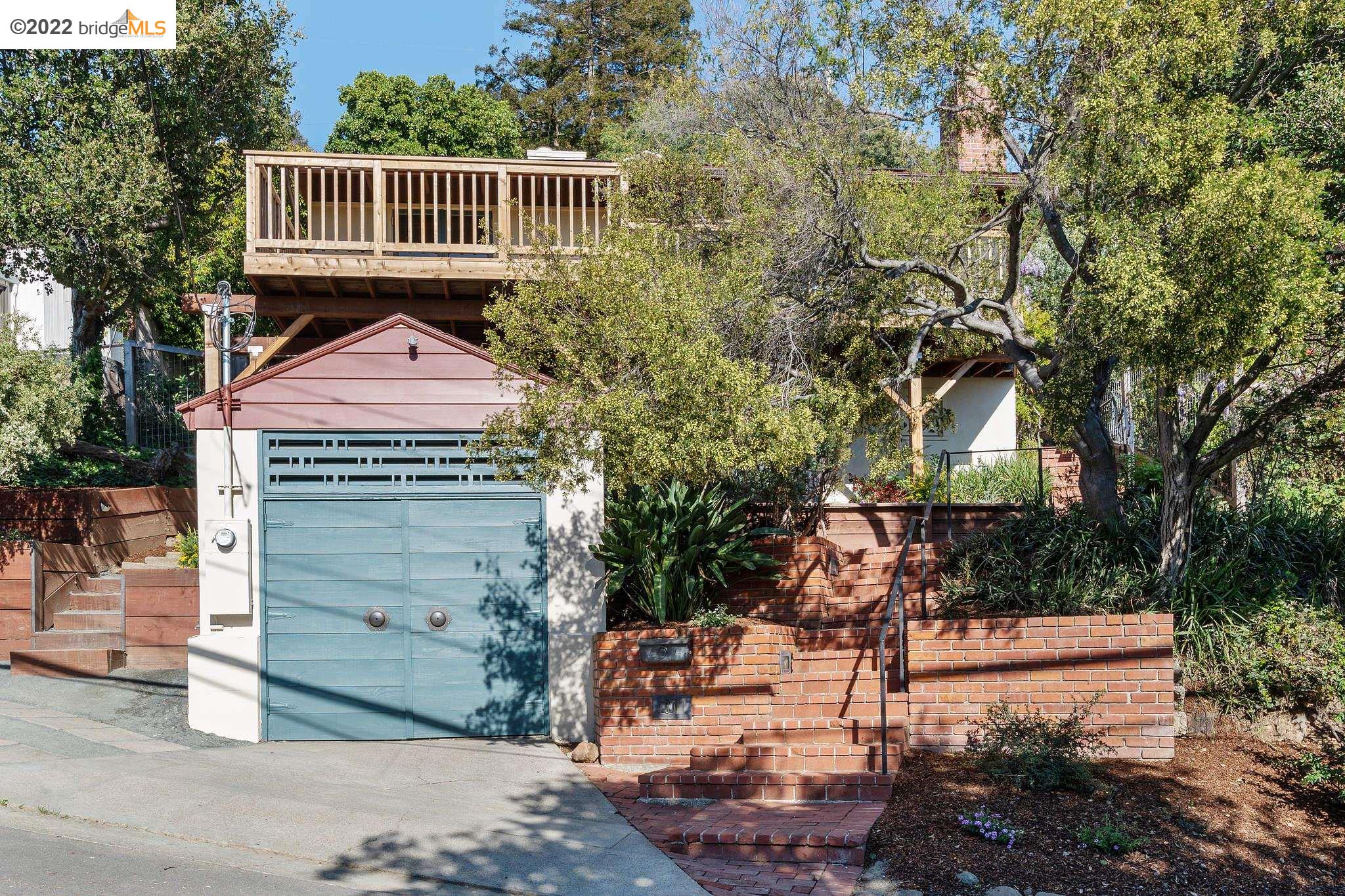 50 Arden Road Berkeley, CA 94704 - Photo 1 of 1 a front view of a house with a garden