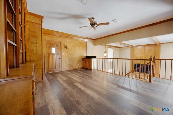 a view of a porch with wooden floor