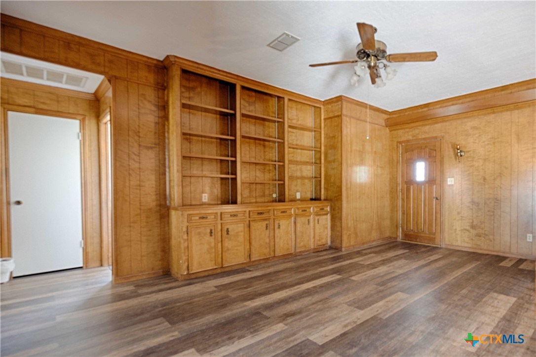 2745 Holub Road Schulenburg, TX 78956 - Photo 25 of 45 a view of empty room with cabinet and wooden floor