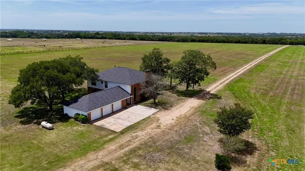 an aerial view of a house having yard
