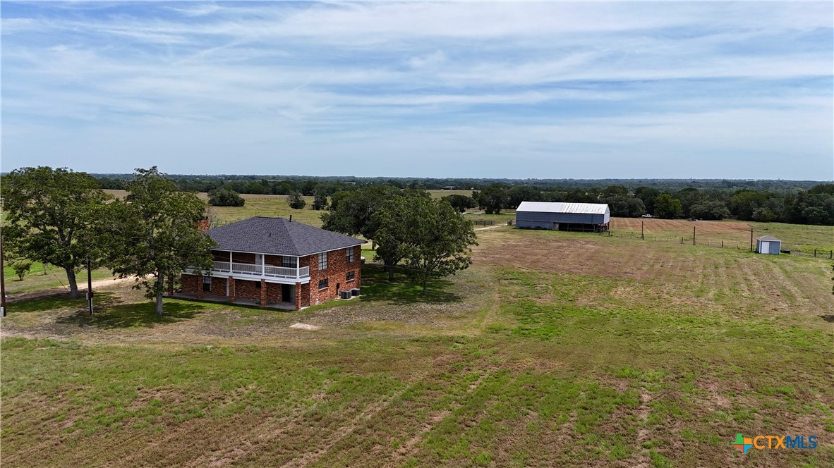 2745 Holub Road Schulenburg, TX 78956 - Photo 7 of 45 an aerial view of a house with balcony