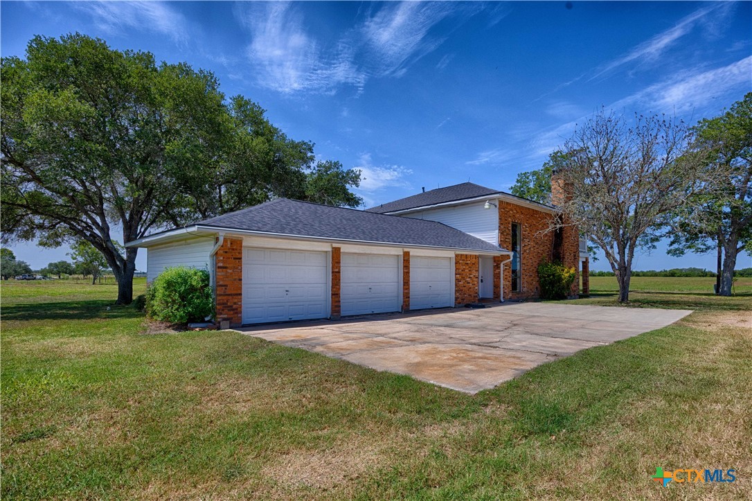 2745 Holub Road Schulenburg, TX 78956 - Photo 9 of 45 a front view of house with yard and trees