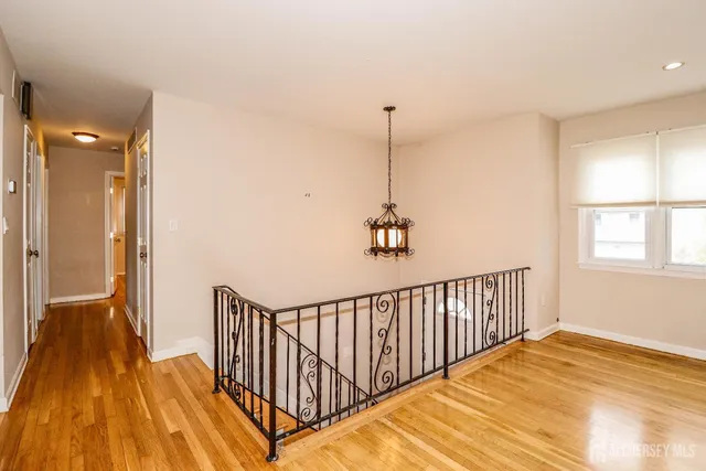 a view of a hallway with a window