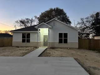a front view of a house with a garage