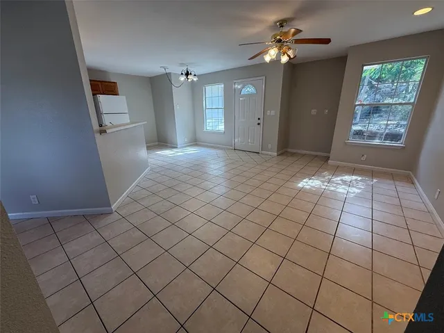 a view of an empty room and window