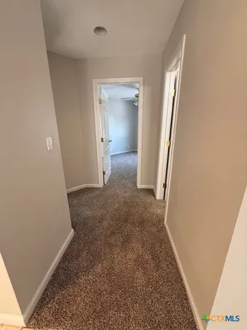 an empty room with a sink