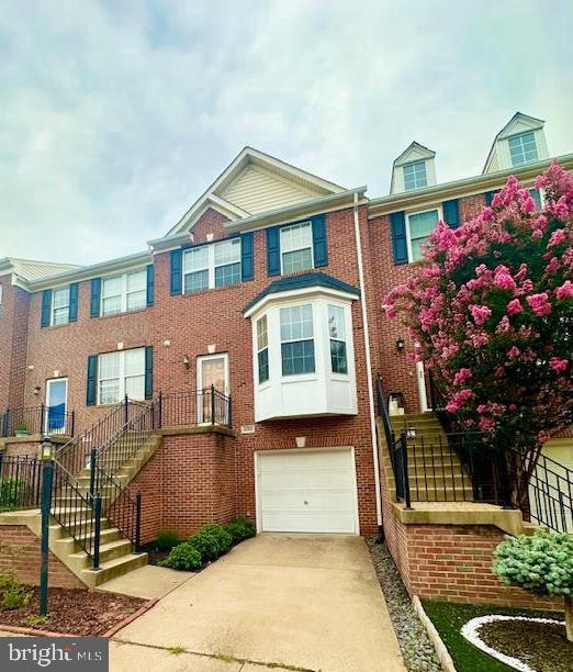43122 Forest Edge Square Broadlands, VA 20148 - Photo 1 of 24 a front view of a house with a yard